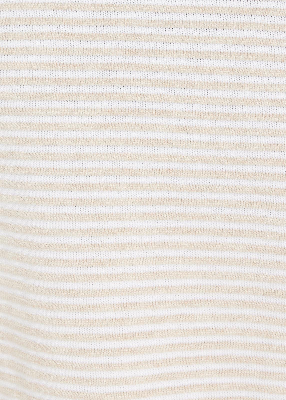 Close-up of beige and white striped knit fabric texture