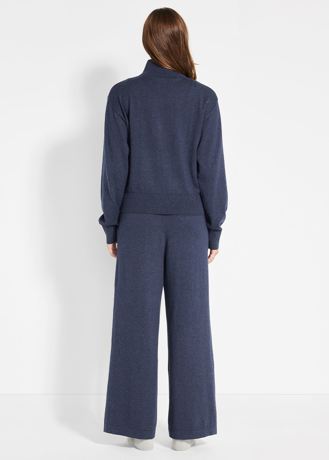 Back view of navy knit lounge set with ribbed waistband and relaxed wide-leg pants
