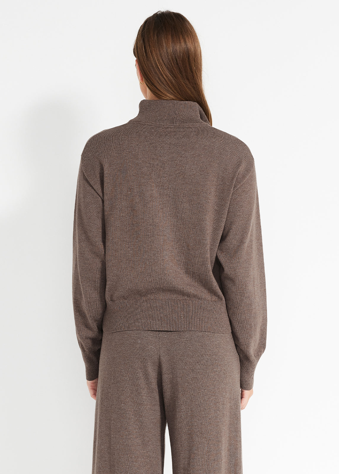 Back view of brown knit lounge set showing ribbed hem and relaxed wide-leg pants.