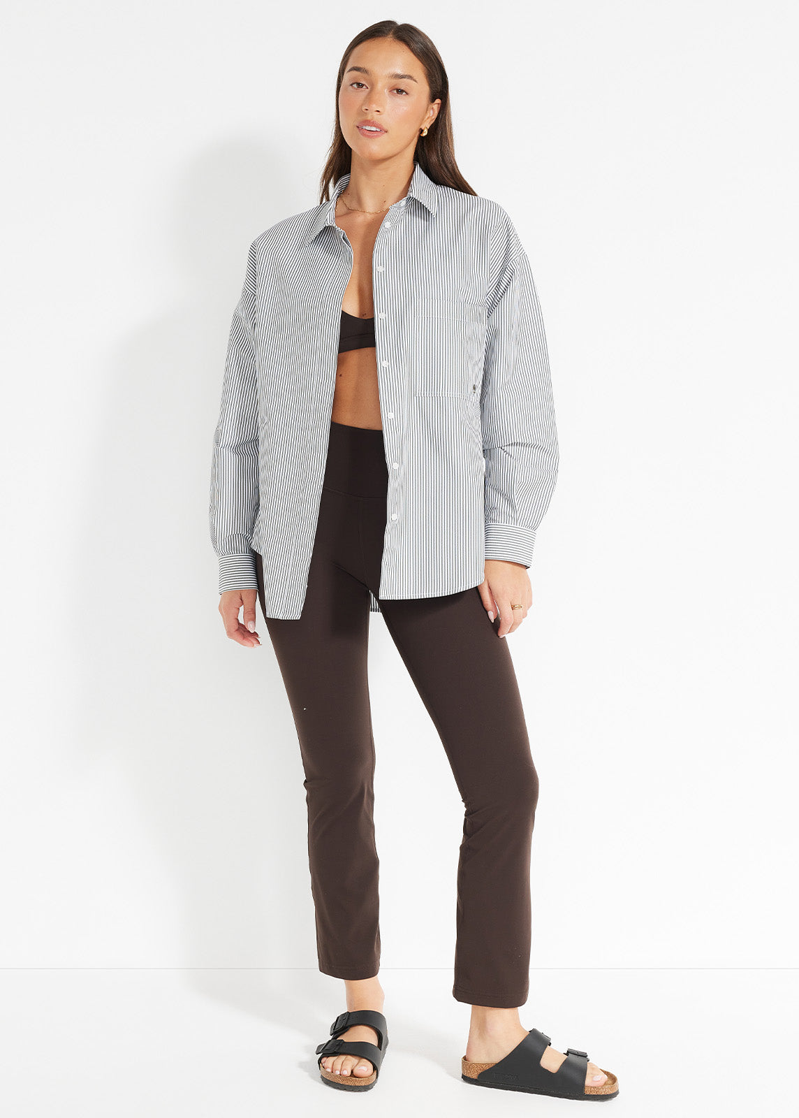 Black leggings with callouts showing supportive waistband and compressive fit details